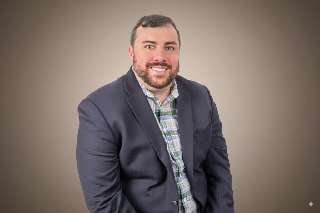 Updated professional headshot in Houston with male professional in navy blazer