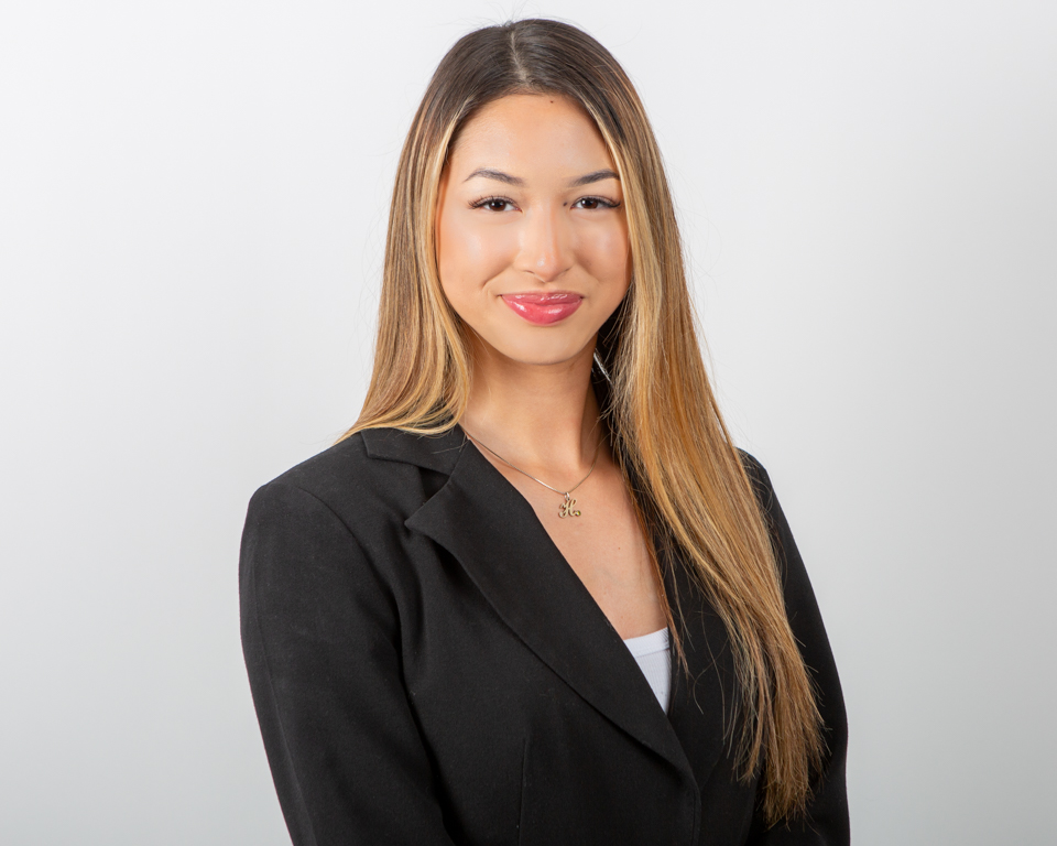 Professional corporate headshot of a business professional in a studio setting